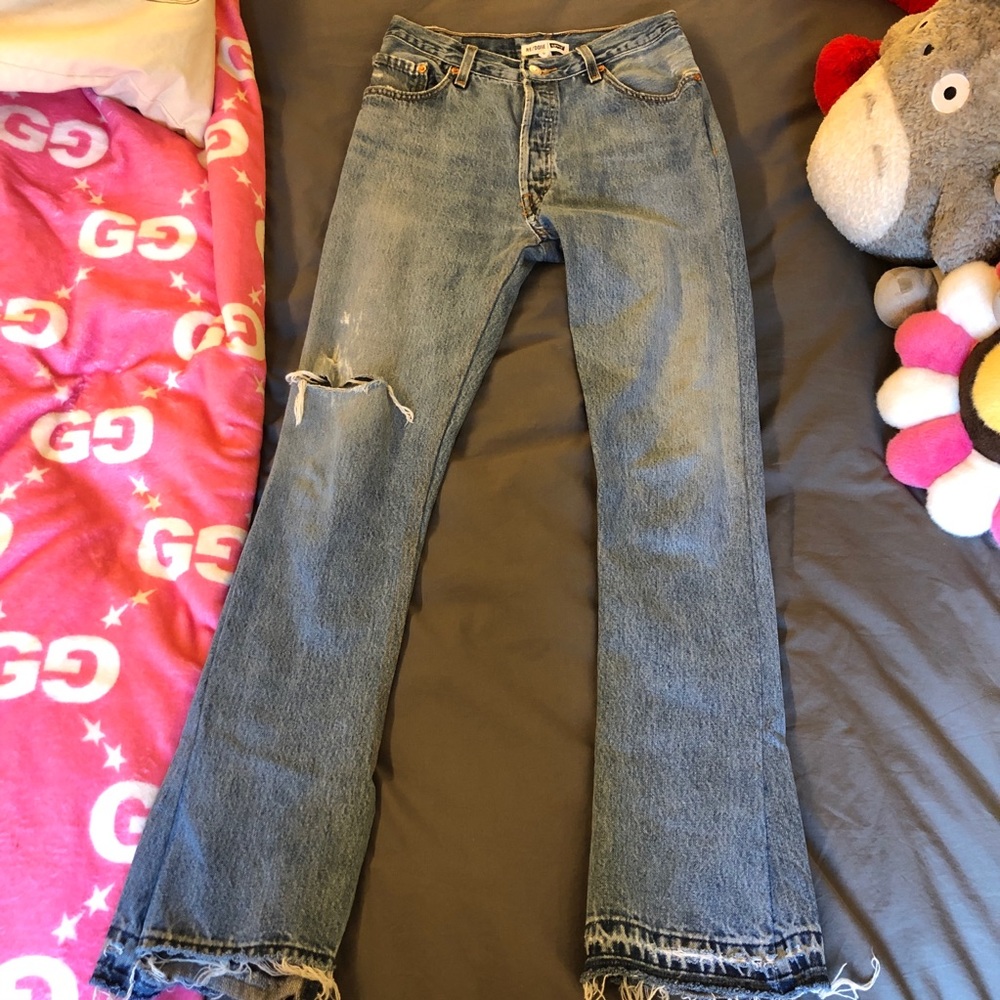 Re/Done distressed jeans with boot cut at ankles